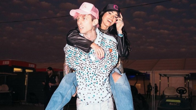 Megan Fox riding piggyback on Machine Gun Kelly