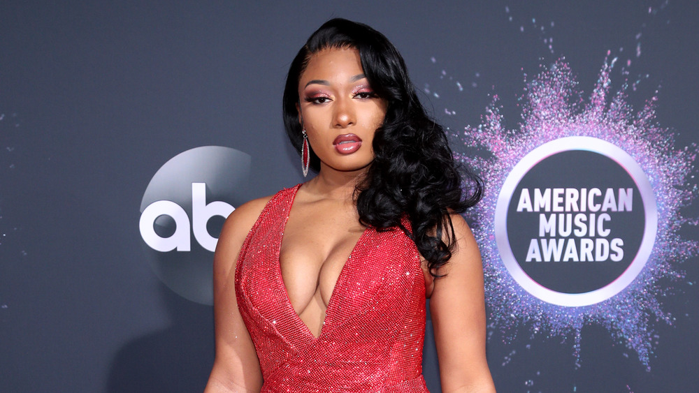 Megan Thee Stallion wears a red dress