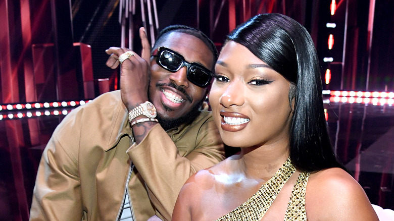 Megan Thee Stallion posing with boyfriend Pardison Fontaine