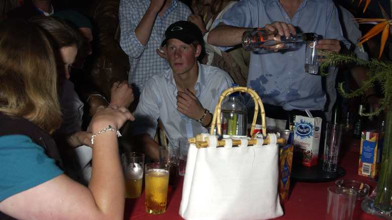 A younger Prince Harry partying