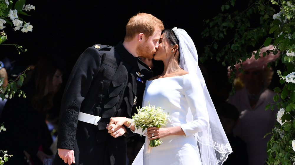 Prince Harry and Meghan Markle kiss