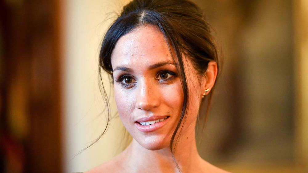 Meghan Markle wearing her hair up at an event