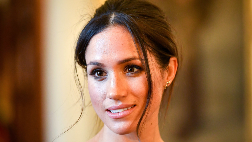 Meghan Markle wearing her hair up at an event