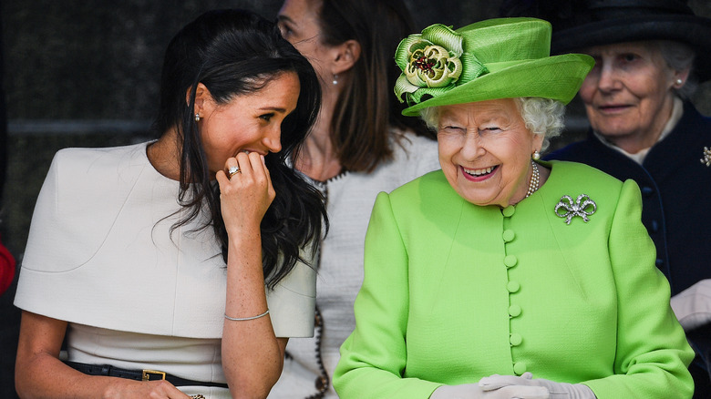 Meghan Markle and Queen Elizabeth chatting 