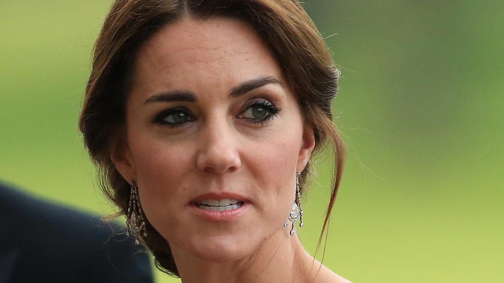 Kate Middleton looks off into the distance.