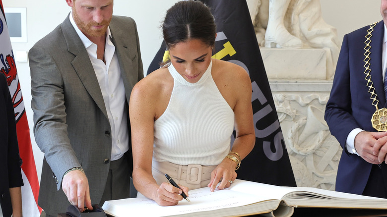 Meghan Markle signing book