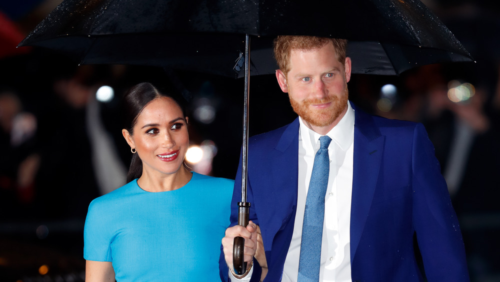 Meghan Markle and Prince Harry both wear blue while out and about