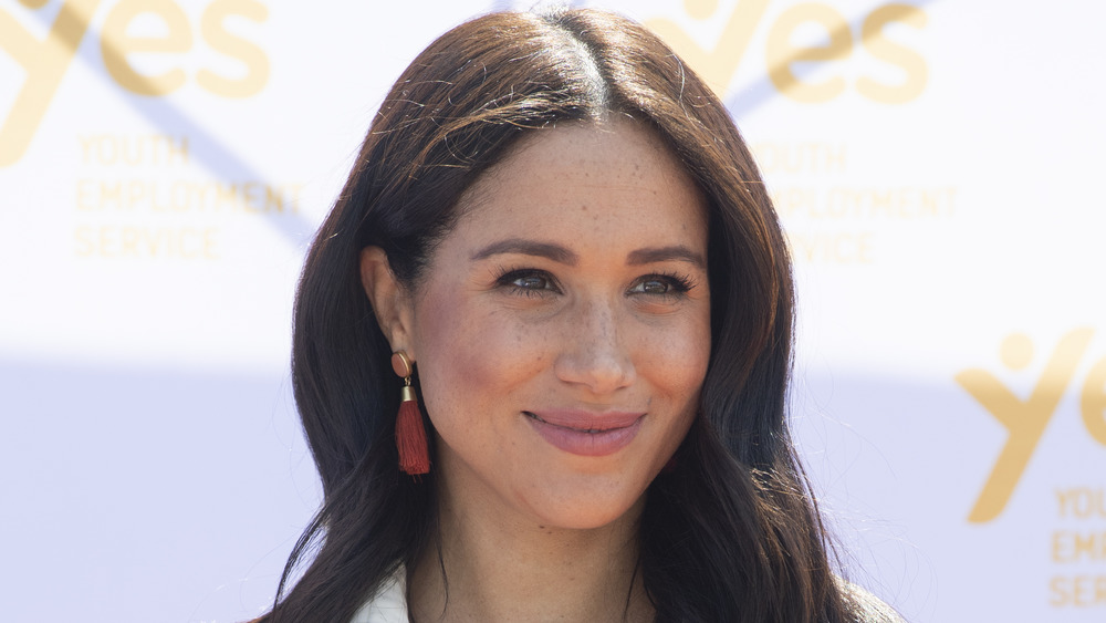 Meghan Markle wearing red tassel earrings