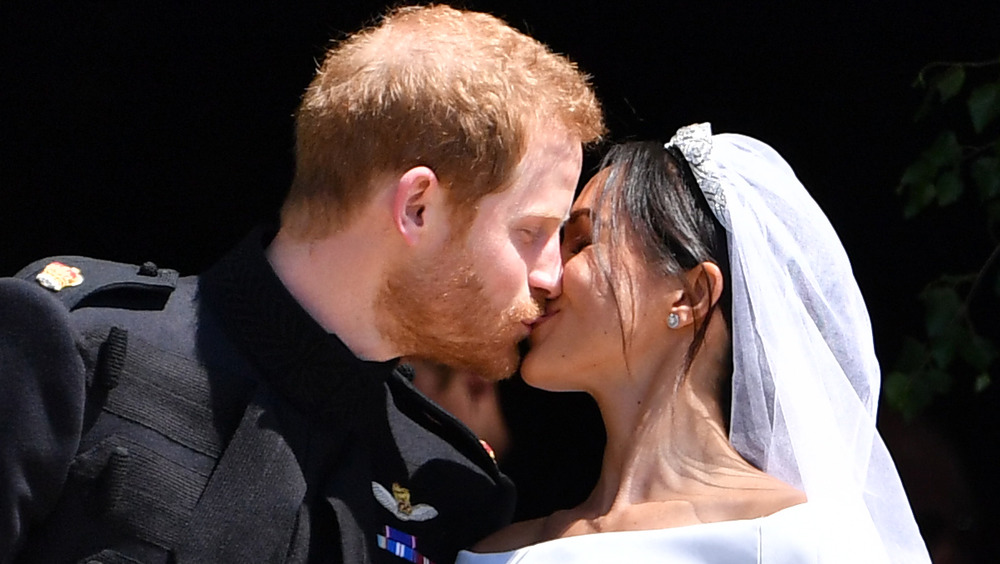 Prince Harry and Meghan Markle kiss