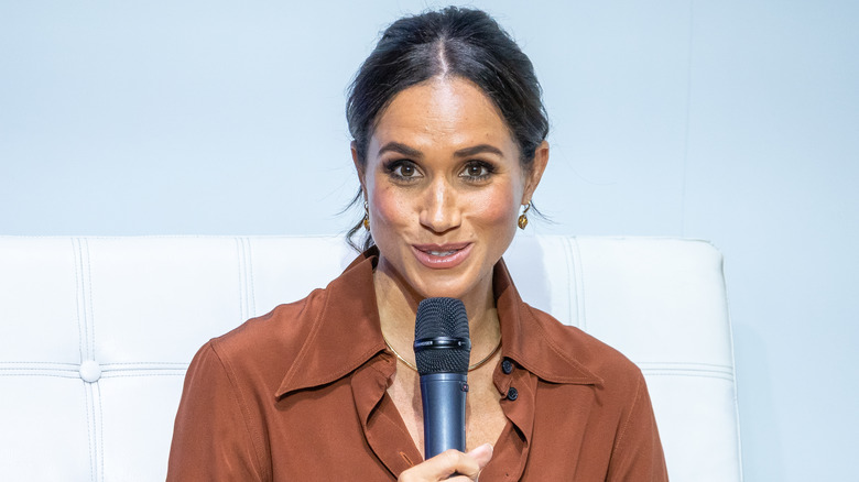 Meghan Markle holding microphone