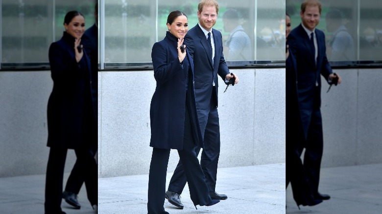 Meghan Markle waving with Prince Harry