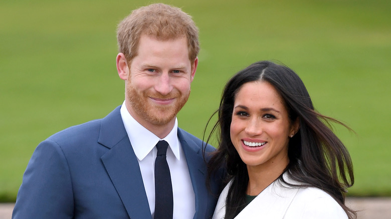 Prince Harry and Meghan Markle smiling