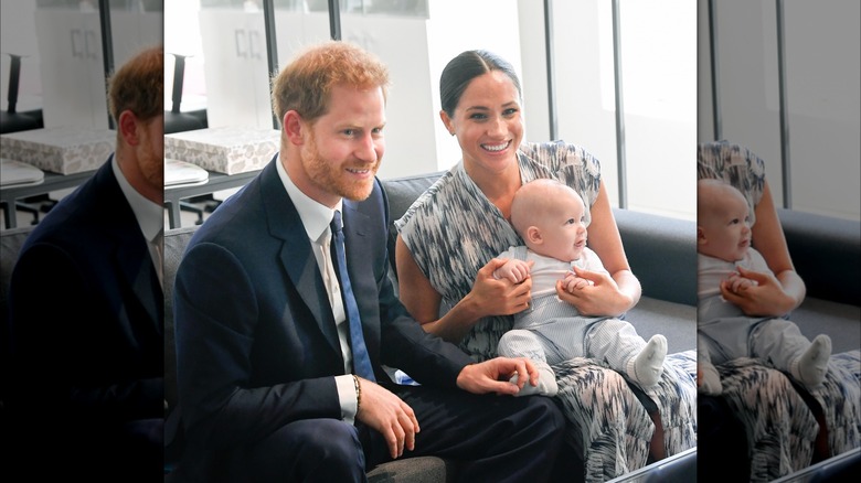 Prince Harry, Meghan Markle, and son Archie posing