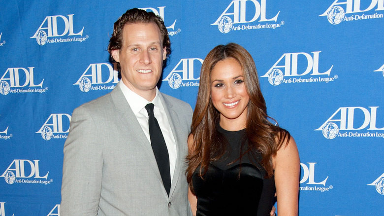 Meghan Markle, Trevor Engelson posing