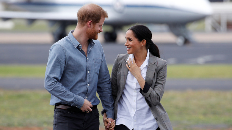 Prince Harry and Meghan Markle looking at each other 