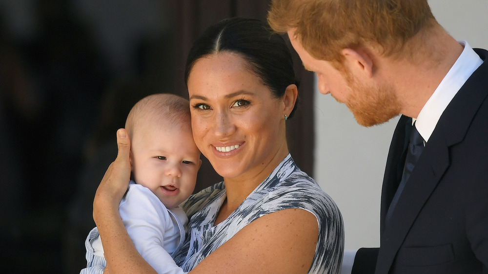 Meghan Markle, Prince Harry, and Archie posing