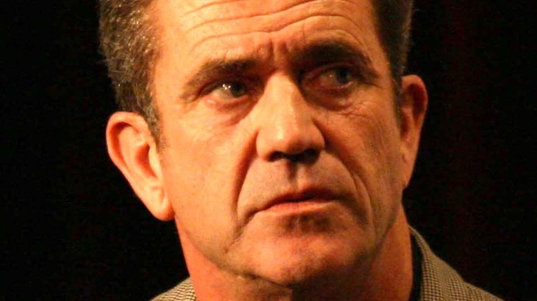 Mel Gibson teary eyed looking right