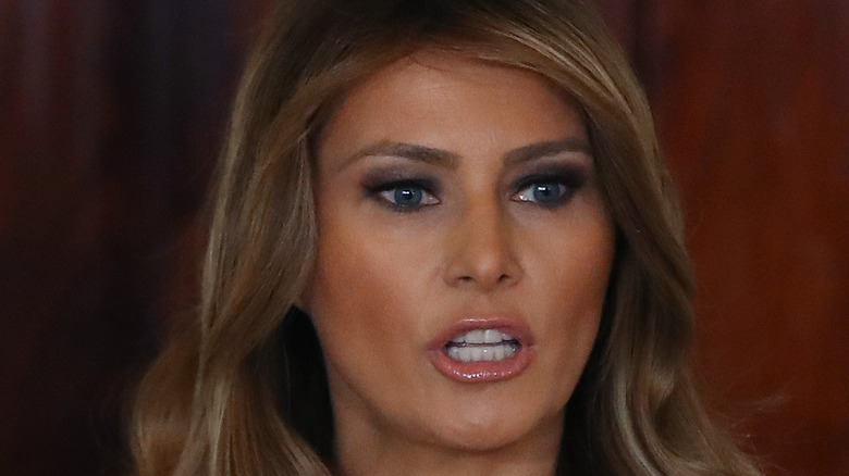 Melania Trump wearing heavy makeup with her mouth open