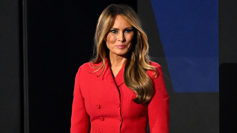 Melania Trump wearing a red suit