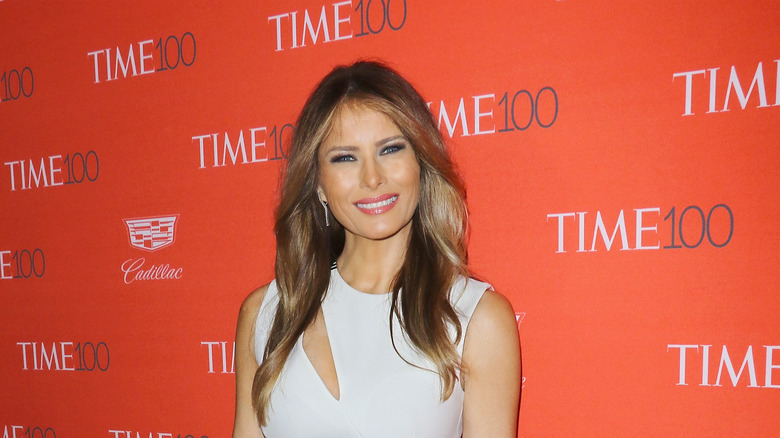 Melania Trump wearing a white dress