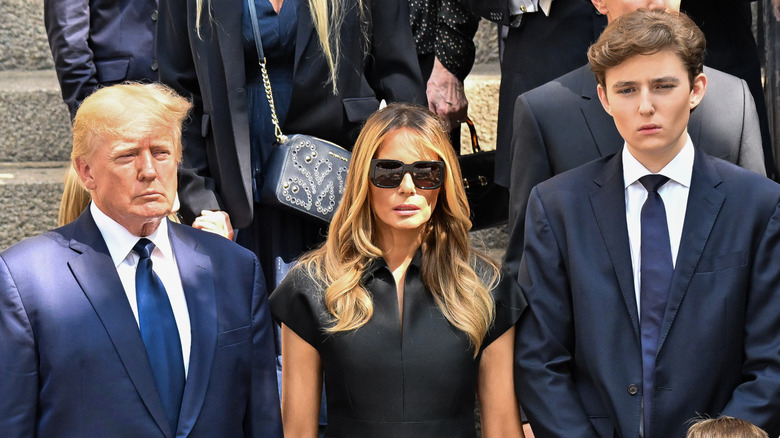 Donald, Melania, and Barron Trump standing together