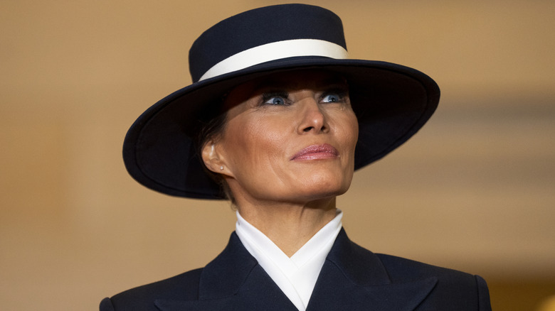 Melania Trump in white striped hat