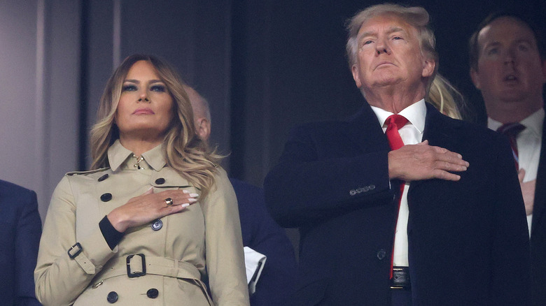 Melania and Donald Trump hands on heart