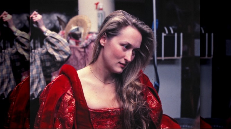 Meryl Streep wearing red costume 