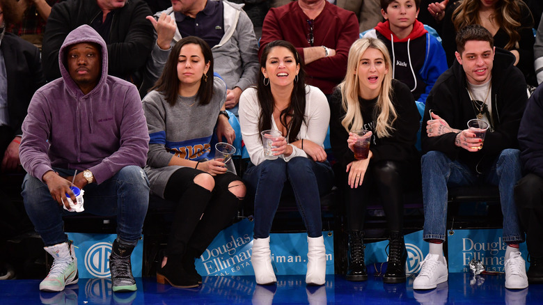 Michael Che and Pete Davidson attend game 