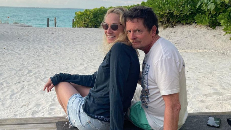 Tracy Pollan and Michael J. Fox pose on the beach