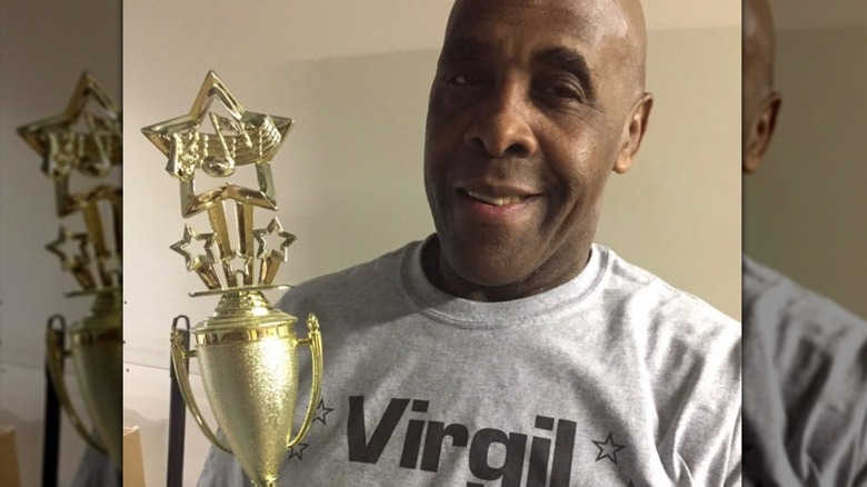 Michael Virgil Jones holding trophy
