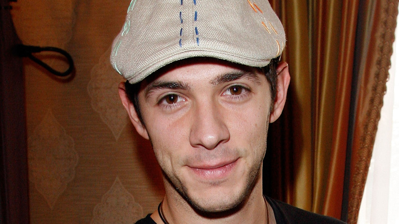 Michael Rady in a cap