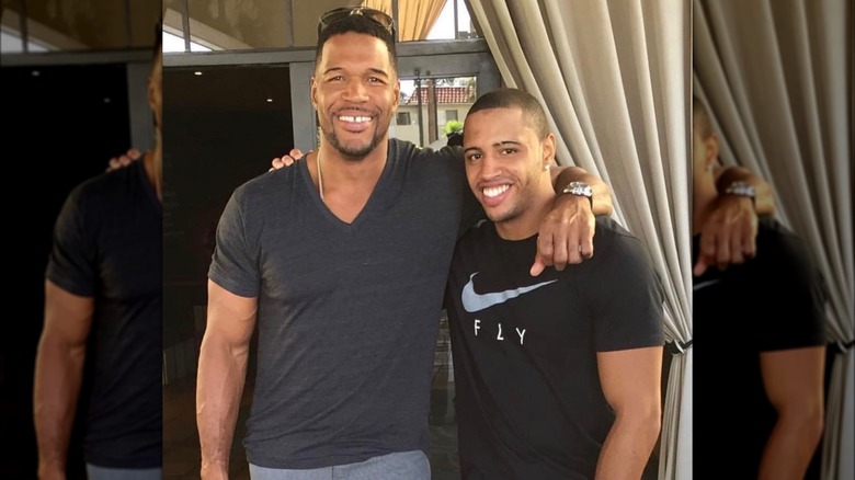 Michael Strahan poses alongside his son Michael Strahan Jr.