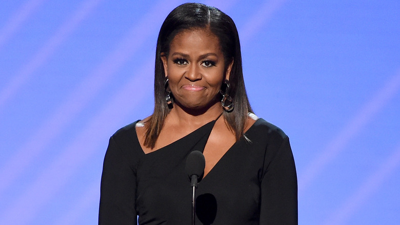 Michelle Obama wearing a black dress