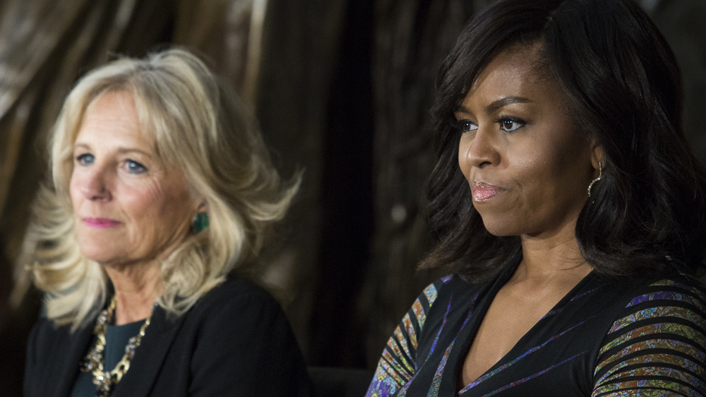 Michelle Obama sits with Jill Biden