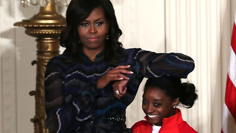 Michelle Obama goofs with Simone Biles at the White House