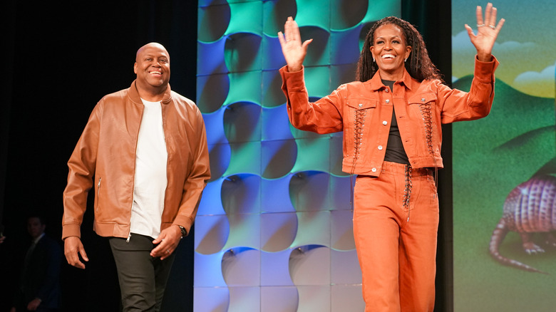 Craig Robinson and Michelle Obama smiling at the SXSW Conference