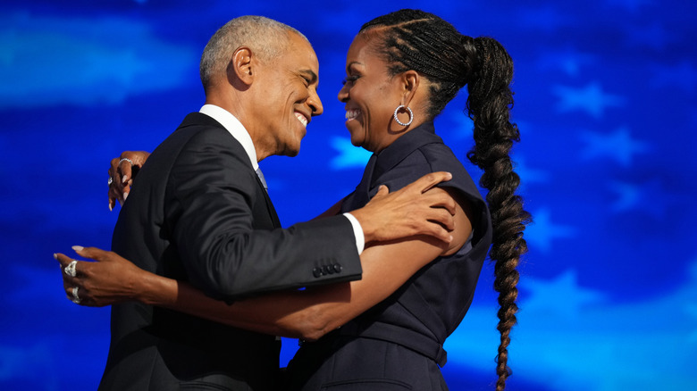 Barack and Michelle Obama hug at the DNC in 2024