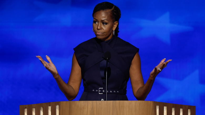 Michelle Obama with arms out