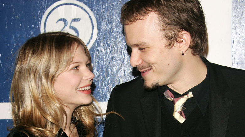 Michelle Williams and Heath Ledger smiling at each other