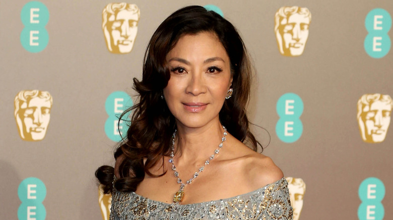 Michelle Yeoh poses on the red carpet