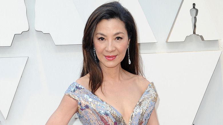 Michelle Yeoh poses on the red carpet