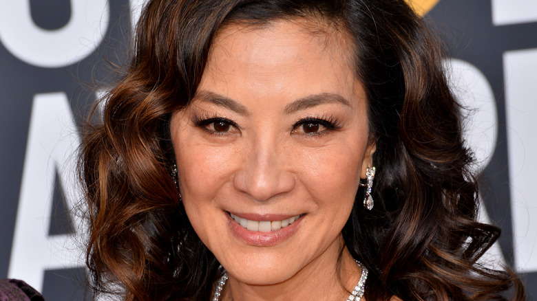 Michelle Yeoh poses on the red carpet at the Golden Globe Awards