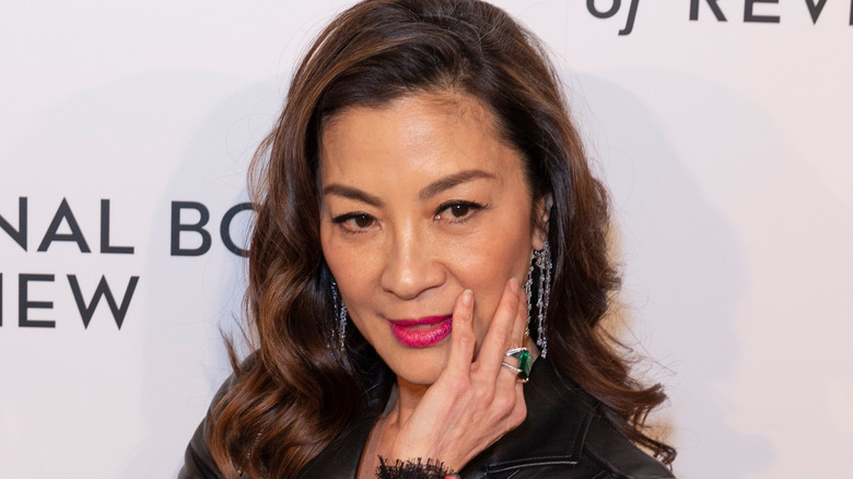 Michelle Yeoh poses on the red carpet