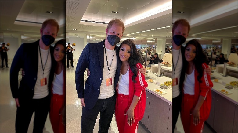 Prince Harry and Mickey Guyton posing together