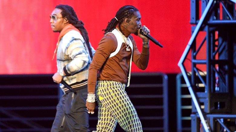 Offset and Takeoff performing on stage