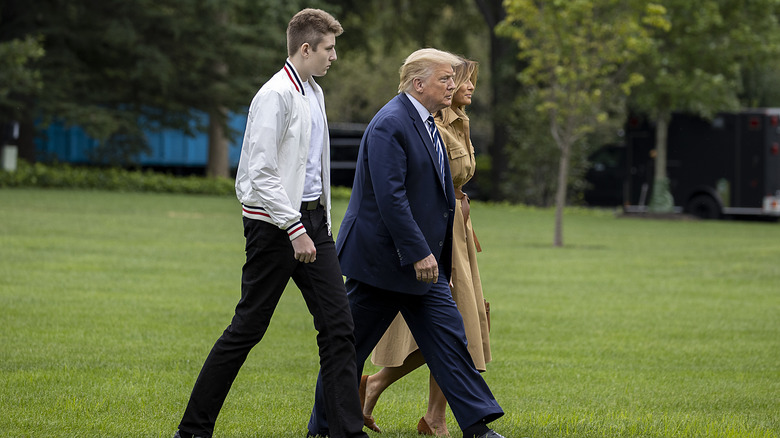 Donald, Melania, and Barron Trump walk