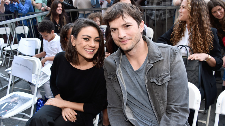 Ashton Kutcher and Mila Kunis sitting down