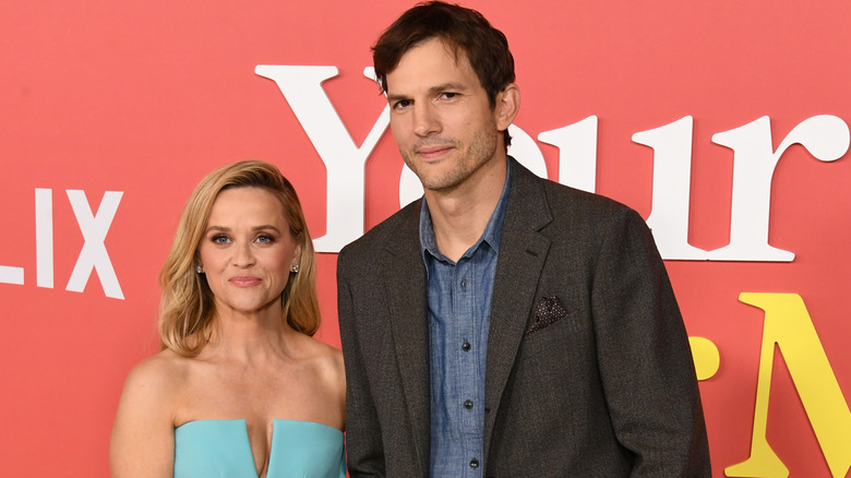 Reese Witherspoon and Ashton Kutcher posing