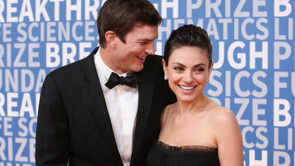 Mila Kunis and Ashton Kutcher on red carpet